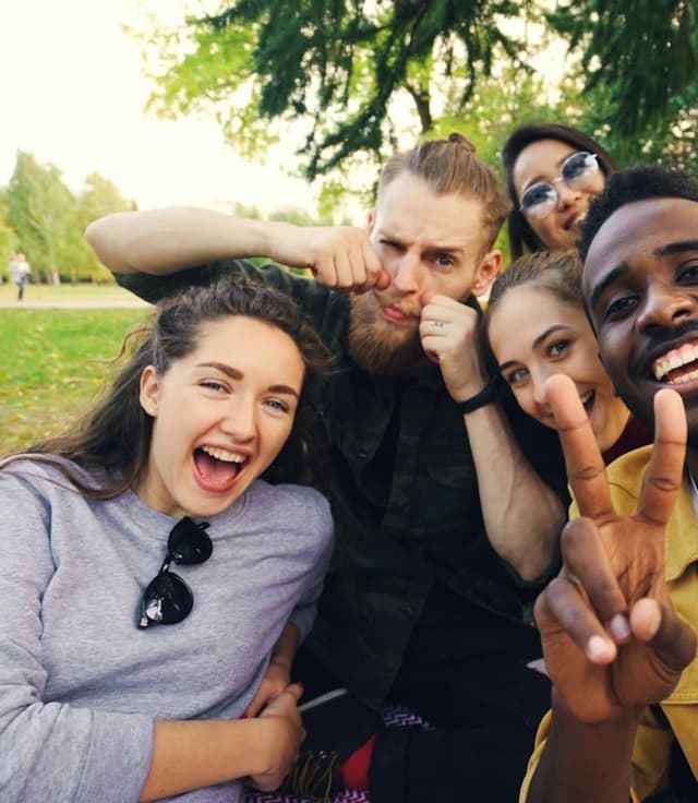 a group of friends laughing in a selfie