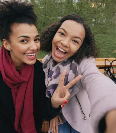 two friends smiling in a selfie