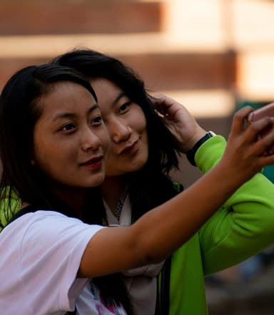 two friends hugging in a selfie